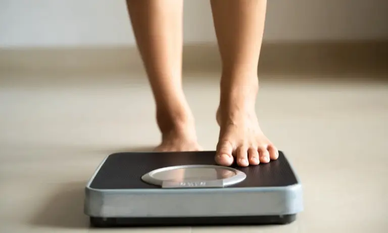 Person with feet on the scale