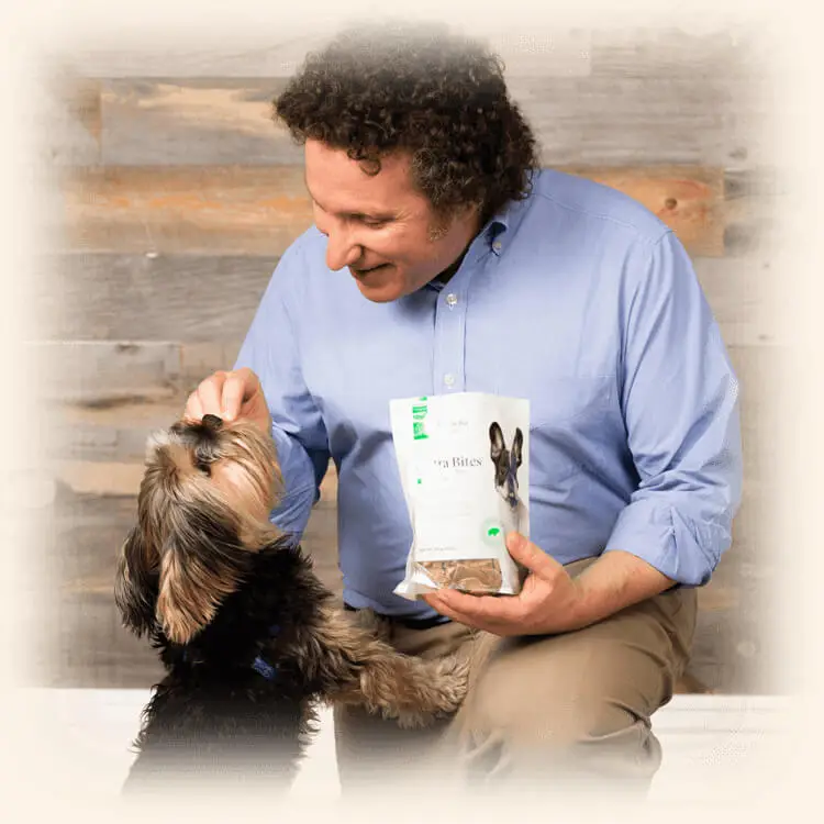 Dr. Gary Richter feeding a dog