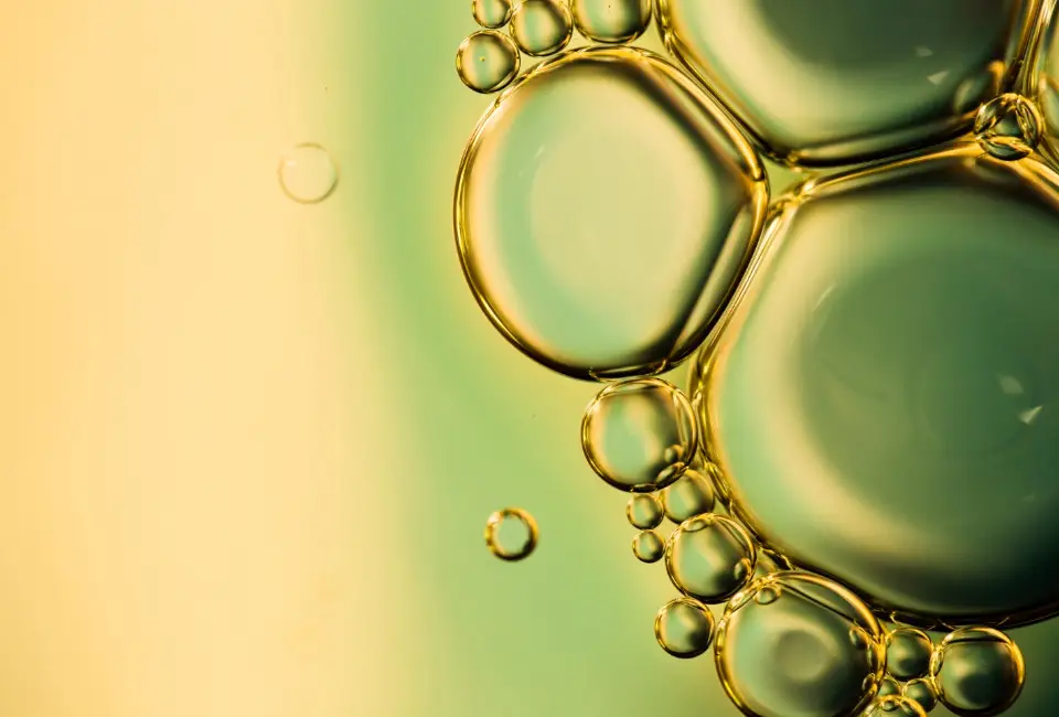 A close up of Gundry MD Olive Oil bubbles on a surface