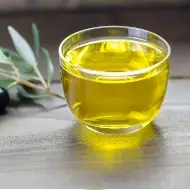Photo of olive oil in a glass