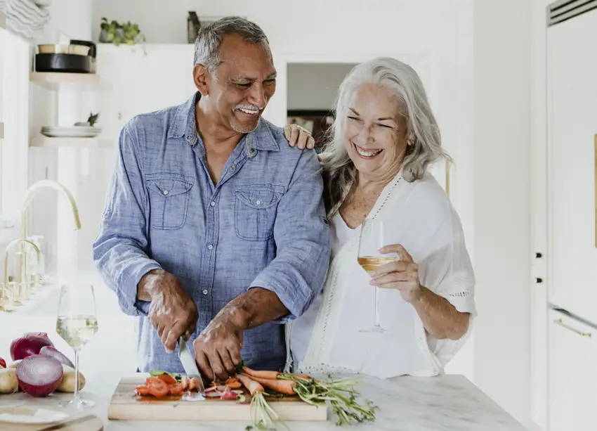 Happy mature couple cooking